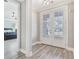 Bright foyer showcasing hardwood floors, natural light and a bedroom view that offer a warm and inviting entrance at 3220 Montebello Pkwy, Cumming, GA 30028