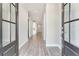Inviting foyer featuring hardwood floors and neutral paint tones that create a bright and welcoming space at 3220 Montebello Pkwy, Cumming, GA 30028