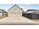 Three-car garage with long driveway and side yard at 3220 Montebello Pkwy, Cumming, GA 30028