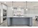 Updated kitchen with large island, stainless appliances, and modern lighting fixtures at 3220 Montebello Pkwy, Cumming, GA 30028