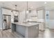 Modern kitchen featuring an island, stainless steel appliances, and ample cabinet space at 3220 Montebello Pkwy, Cumming, GA 30028