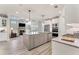 Spacious kitchen with granite counters, stainless appliances, and an open view of living area at 3220 Montebello Pkwy, Cumming, GA 30028