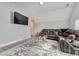 Inviting living room with plush sectional, hardwood floors, and mounted TV for modern comfort and entertainment at 3220 Montebello Pkwy, Cumming, GA 30028