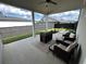 Covered patio with comfortable seating and grill is ideal for entertaining or relaxing in style at 3220 Montebello Pkwy, Cumming, GA 30028