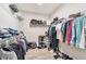 Walk-in closet featuring built-in shelving for organization and maximizing storage space at 3220 Montebello Pkwy, Cumming, GA 30028