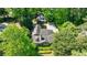 Expansive home nestled within a canopy of lush trees, providing both privacy and natural beauty at 728 Wesley Nw Dr, Atlanta, GA 30305