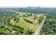 Scenic view of a verdant golf course near a city skyline, blending recreation with urban living at 728 Wesley Nw Dr, Atlanta, GA 30305