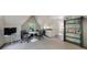 Entertaining area includes TV, bar, table and chairs with a shelf for decor at 728 Wesley Nw Dr, Atlanta, GA 30305