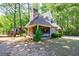 Cottage features a lush green yard, playground, and basketball court surrounded by mature trees at 728 Wesley Nw Dr, Atlanta, GA 30305