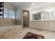 Spacious bathroom featuring a large soaking tub with tile surround, glass enclosed shower and double sink vanity with great lighting at 728 Wesley Nw Dr, Atlanta, GA 30305