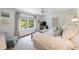 Serene bedroom with a ceiling fan, a large window, and neutral decor for a relaxing ambiance at 728 Wesley Nw Dr, Atlanta, GA 30305