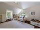 Bright bonus room featuring hardwood floors, natural light, and a cozy couch at 728 Wesley Nw Dr, Atlanta, GA 30305
