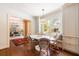 Bright breakfast nook with built-in bench seating and a pendant light, adjacent to a living room with stylish decor at 728 Wesley Nw Dr, Atlanta, GA 30305