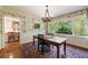 Charming dining room with a unique chandelier and large windows, creating an inviting atmosphere at 728 Wesley Nw Dr, Atlanta, GA 30305