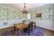 Charming dining room with an unique chandelier and large windows, creating an inviting atmosphere at 728 Wesley Nw Dr, Atlanta, GA 30305