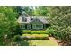 Charming home surrounded by lush greenery, showcasing its classic architecture and manicured landscaping at 728 Wesley Nw Dr, Atlanta, GA 30305