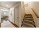 Bright hallway with staircase and view to a dining room provides natural light and an inviting transition between spaces at 728 Wesley Nw Dr, Atlanta, GA 30305