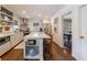 Spacious kitchen features a center island, stainless appliances, marble countertops, and decorative display shelving at 728 Wesley Nw Dr, Atlanta, GA 30305