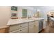 Kitchen island sink with stainless steel dishwasher and custom cabinetry, complemented by elegant marble countertops at 728 Wesley Nw Dr, Atlanta, GA 30305