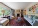 Bright living room with large windows, a decorative fireplace, and elegant furnishings, perfect for relaxation at 728 Wesley Nw Dr, Atlanta, GA 30305