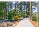 Picturesque walking path lined with mature trees and stone accents, ideal for a serene outdoor experience at 728 Wesley Nw Dr, Atlanta, GA 30305