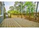 Newly constructed wood deck with railings and view of the backyard at 1697 Ramblewood Way, Snellville, GA 30078
