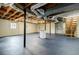 Unfinished basement with painted floors, exposed ductwork, and stairs at 1697 Ramblewood Way, Snellville, GA 30078