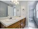 Bathroom featuring double sink vanity, ample countertop space, and plenty of storage at 1697 Ramblewood Way, Snellville, GA 30078
