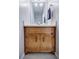 Charming bathroom vanity with wooden cabinet, marble top and decorative hardware at 1697 Ramblewood Way, Snellville, GA 30078