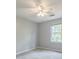 This bedroom has a ceiling fan and a window with natural light at 1697 Ramblewood Way, Snellville, GA 30078