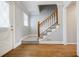 Welcoming foyer with hardwood floors, staircase, and natural light at 1697 Ramblewood Way, Snellville, GA 30078