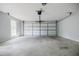Clean and empty garage featuring a white door, ready for customization at 1697 Ramblewood Way, Snellville, GA 30078