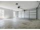 Spacious garage with room for parking and storage, featuring natural light from the windows at 1697 Ramblewood Way, Snellville, GA 30078