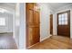 Well-maintained hallway with hardwood flooring, classic doors and neutral walls at 1697 Ramblewood Way, Snellville, GA 30078