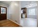 Inviting kitchenette area featuring classic wood cabinetry, white appliances, and large window for natural light at 1697 Ramblewood Way, Snellville, GA 30078