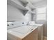 Functional laundry room with washer, dryer, and built-in shelving at 1697 Ramblewood Way, Snellville, GA 30078