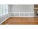 Bright living room features hardwood floors, classic trim with windows that provide ample natural light at 1697 Ramblewood Way, Snellville, GA 30078