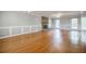 Open living room boasts hardwood floors, classic trim and a brick fireplace with windows for natural light at 1697 Ramblewood Way, Snellville, GA 30078