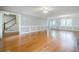 Spacious living room with hardwood floors, large windows and classic trim, perfect for entertaining at 1697 Ramblewood Way, Snellville, GA 30078