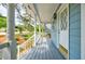Charming front porch with painted floors, offering a view of the neighborhood at 1697 Ramblewood Way, Snellville, GA 30078