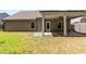 Exterior of a home with a covered patio overlooking the backyard at 2075 Villa Spring Ct, Dacula, GA 30019