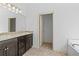 Bathroom featuring double vanity with granite countertop and walk-in closet at 2075 Villa Spring Ct, Dacula, GA 30019