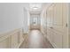 Bright hallway with decorative molding and wood-look flooring leading to the front door at 2075 Villa Spring Ct, Dacula, GA 30019