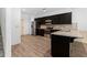 Modern kitchen featuring stainless steel appliances, granite countertops, and dark cabinets at 2075 Villa Spring Ct, Dacula, GA 30019