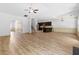 Spacious living area with wood floors, kitchen island, and stairway at 2075 Villa Spring Ct, Dacula, GA 30019