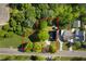 Aerial view of property showing the house and surrounding tree lined lot at 30 Village Dr, Cartersville, GA 30121