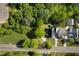 Aerial view of property showing the house and surrounding tree lined lot at 30 Village Dr, Cartersville, GA 30121