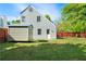 Home exterior features a spacious backyard, a storage shed, and a well-maintained lawn at 30 Village Dr, Cartersville, GA 30121