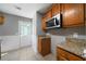 Cozy kitchen featuring granite counters and stainless steel microwave at 30 Village Dr, Cartersville, GA 30121