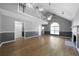 Bright living room featuring a fireplace, staircase and vaulted ceilings at 30 Village Dr, Cartersville, GA 30121
